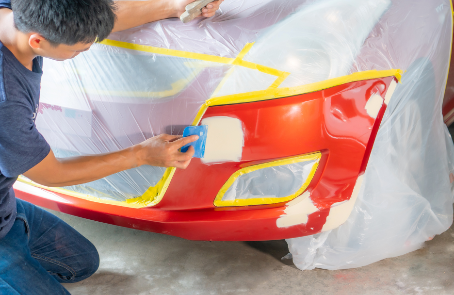 Car Dent Being Repaired By An Auto Body Technician In La Grange, Illinois