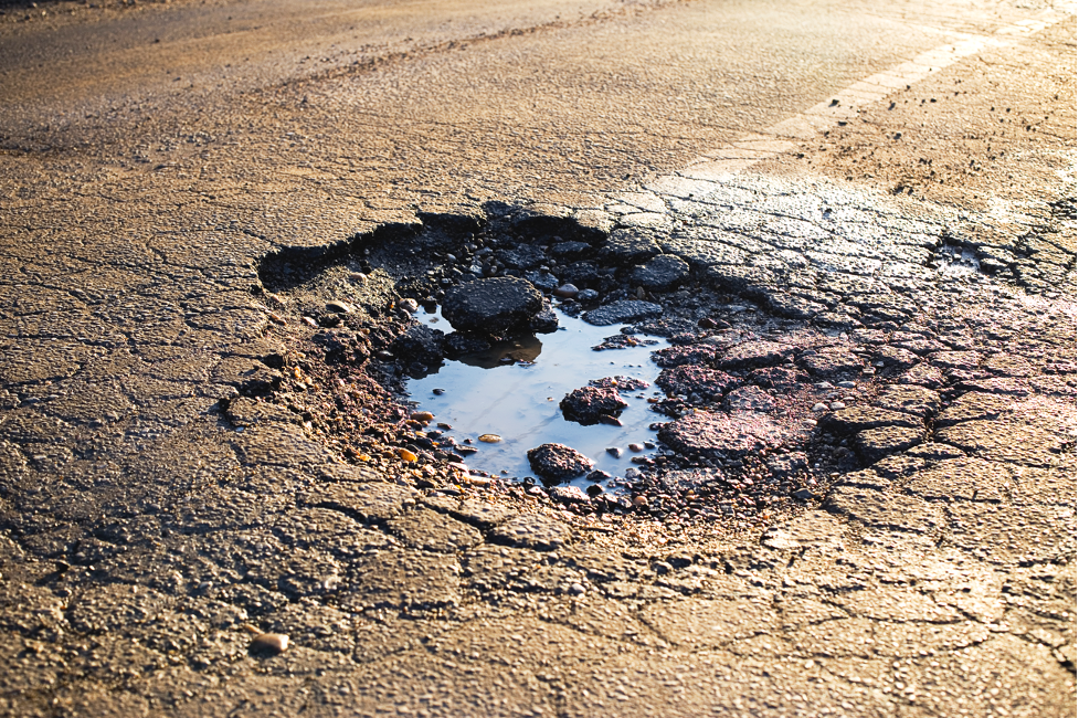 Car Damage From A Road Pothole In Forest Park, Illinois