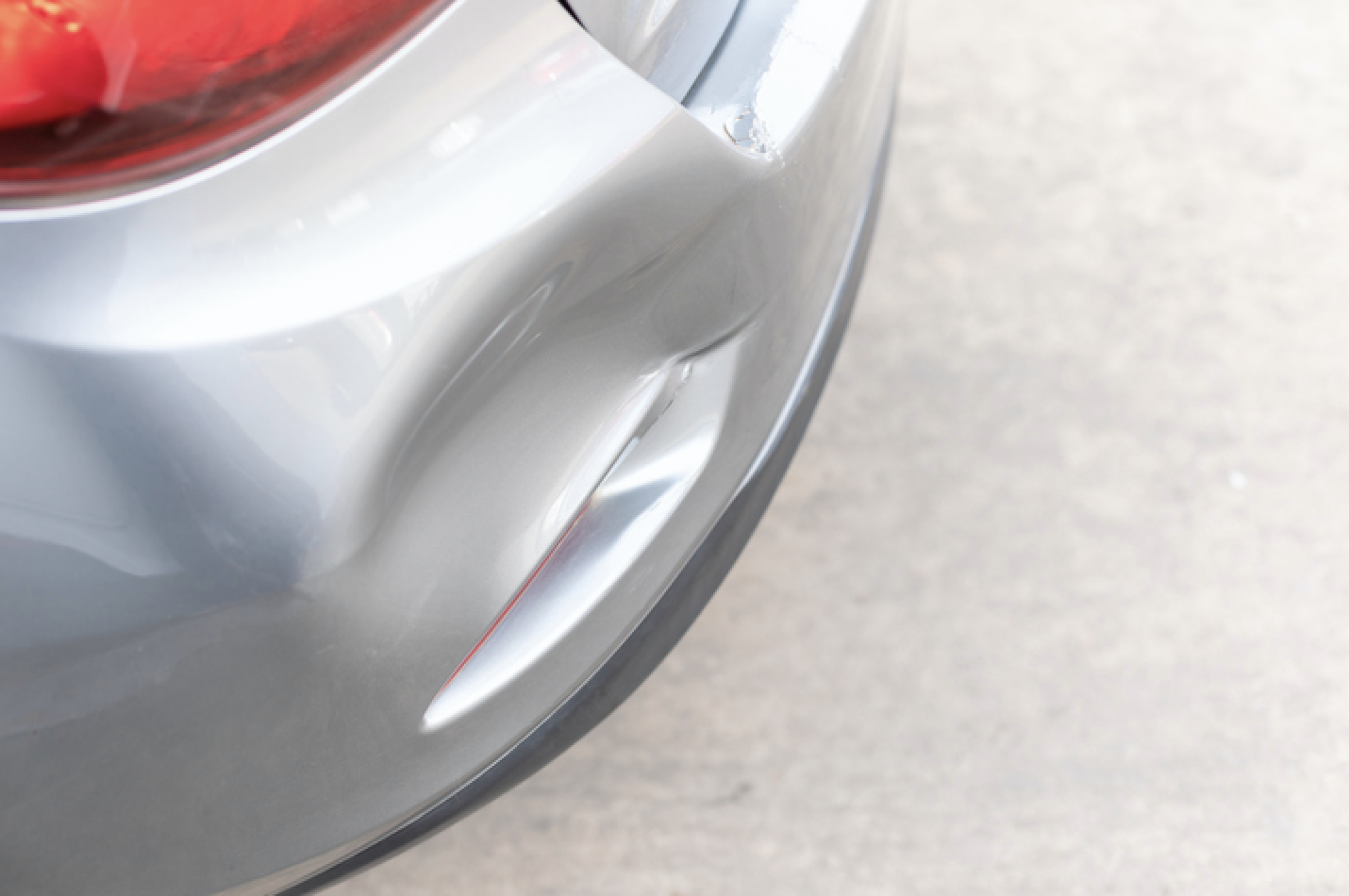 Dented Car Bumper Repair At An Auto Body Shop In Oak Brook, Illinois